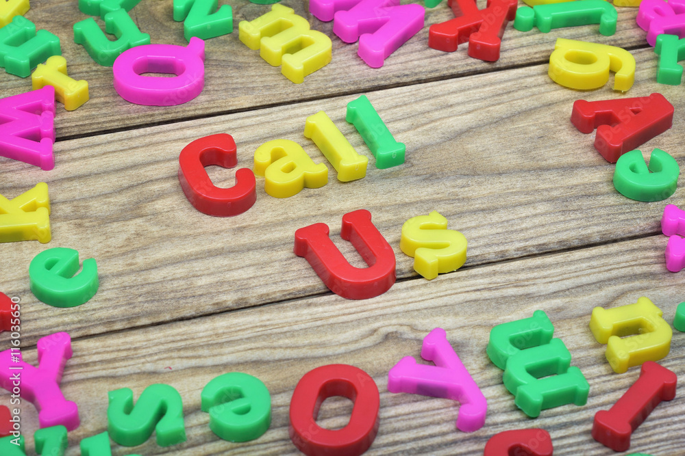 Call Us on wooden table Call Us on wooden table
