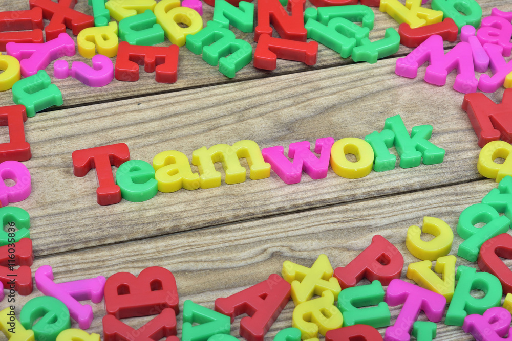 Teamwork on wooden table Teamwork on wooden table