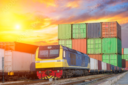 Cargo train platform at sunset with container