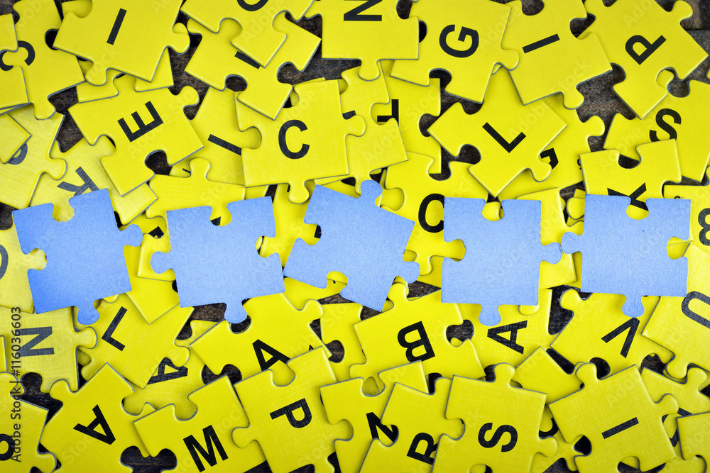 Puzzle on wooden table Puzzle on wooden table
