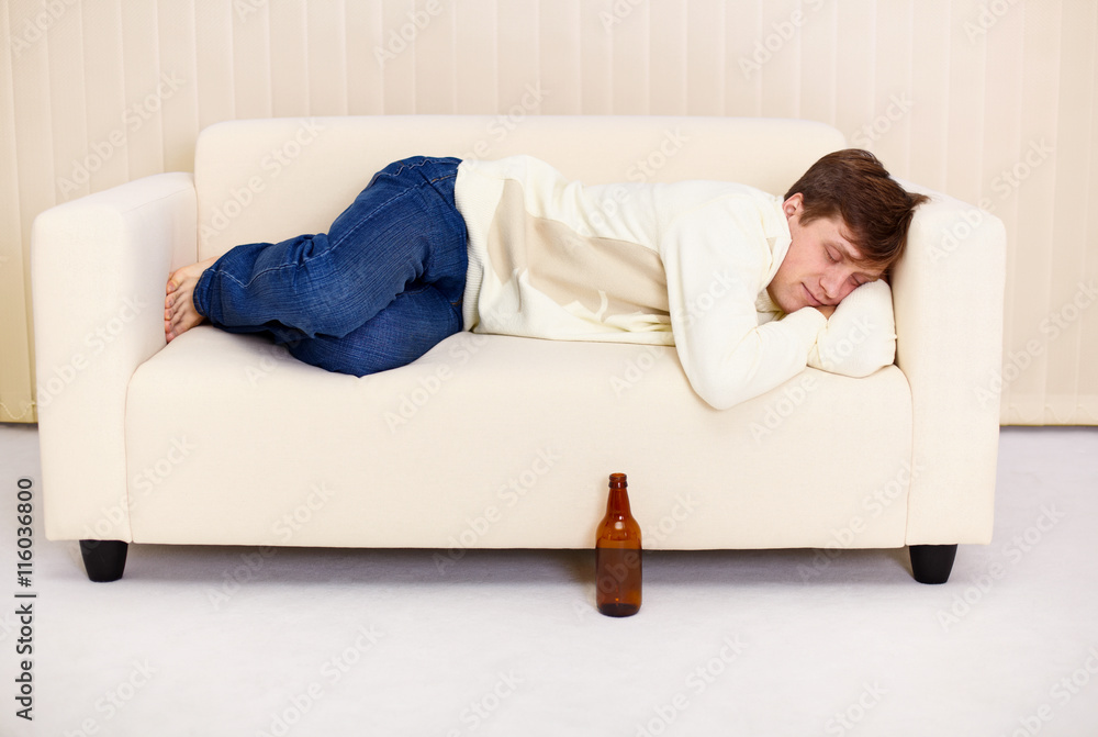 People comfortable sleeps on sofa having got drunk beer People comfortable sleeps on sofa having got drunk beer