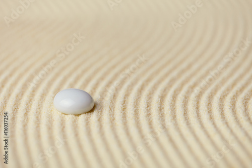 Abstract background of sand with white glass stone