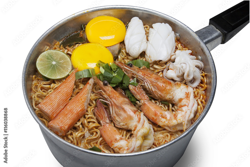 Bowl of spicy instant noodles isolated on white background. Topping with eggs, lemon, pork , crispy pork, sausage and coriander Bowl of spicy instant noodles isolated on white background. Topping with eggs, lemon, pork , crispy pork, sausage and coriander