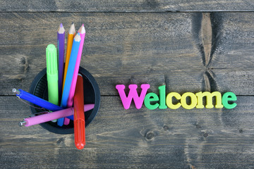 Welcome on wooden table