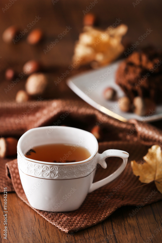 Cup of tea with autumn decor on wooden table. Cup of tea with autumn decor on wooden table.
