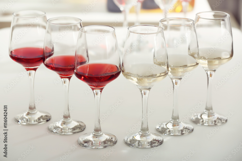 Wine glasses with red and white wine, closeup Wine glasses with red and white wine, closeup