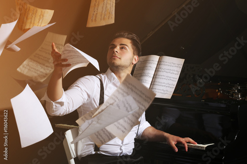 Handsome musician with piano
