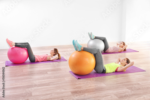 Young women doing exercise ...
