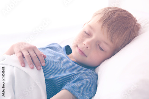 Adorable little boy sleepin...