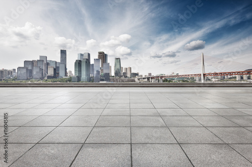 empty floor with cityscape and skyline of chongqing in clous sky © zhu difeng
