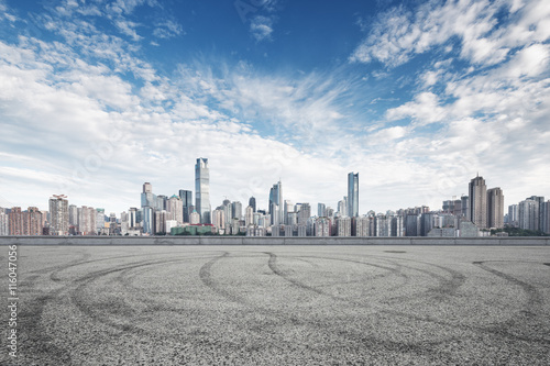 empty road with cityscape and skyline of chongqing in cloud sky photo