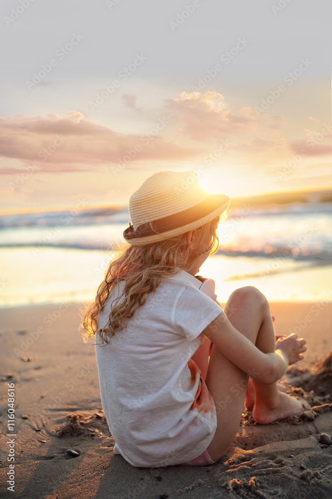 Young girl in summer holiday in hat on a beach Stock Photo | Adobe Stock