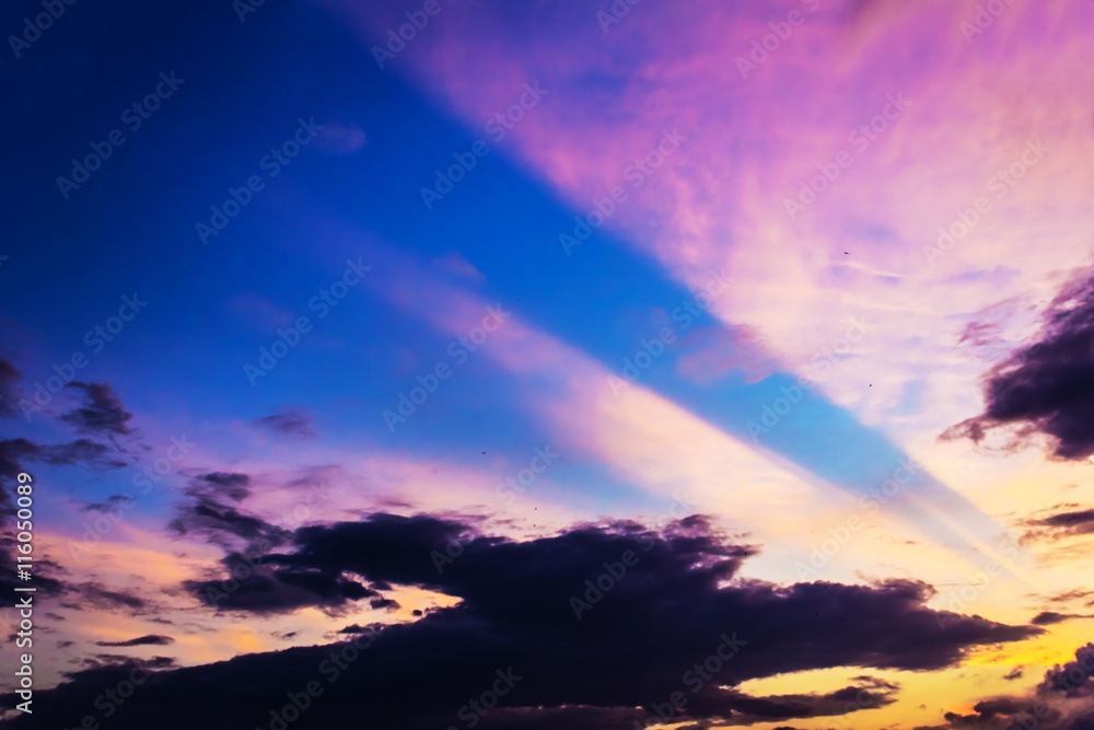 colorful yellow sunrise, sunset clouds and sun rays