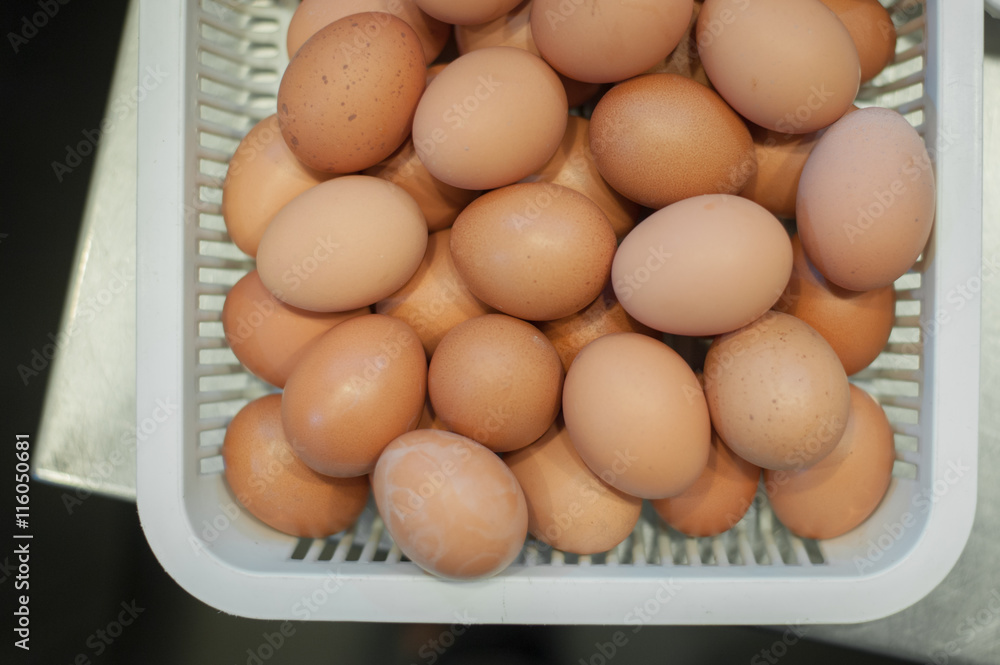 Egg, Chicken Egg in white plastic basket Egg, Chicken Egg in white plastic basket