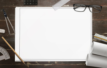 Blank paper for drawing the construction project. Accessories for the drawing is arranged around the paper.