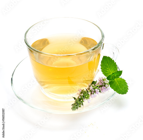 Obraz na płótnie Cup of green tea with mint leaves and flower w salonie