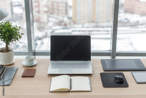 Tableau sur toile Office. Comfortable work table, workplace with notebook laptop.