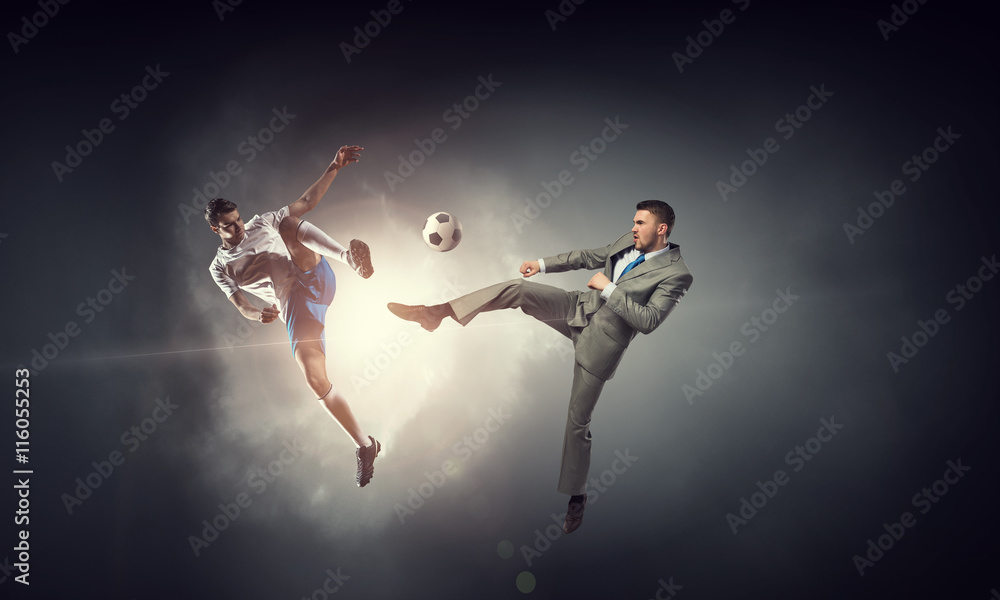 Businessman kicking ball . Mixed media