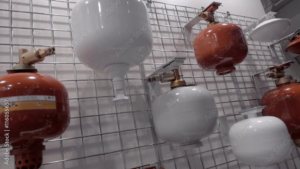 Automatic, wall extinguishers in red and white colors at the exhibition Automatic, wall extinguishers in red and white colors at the exhibition