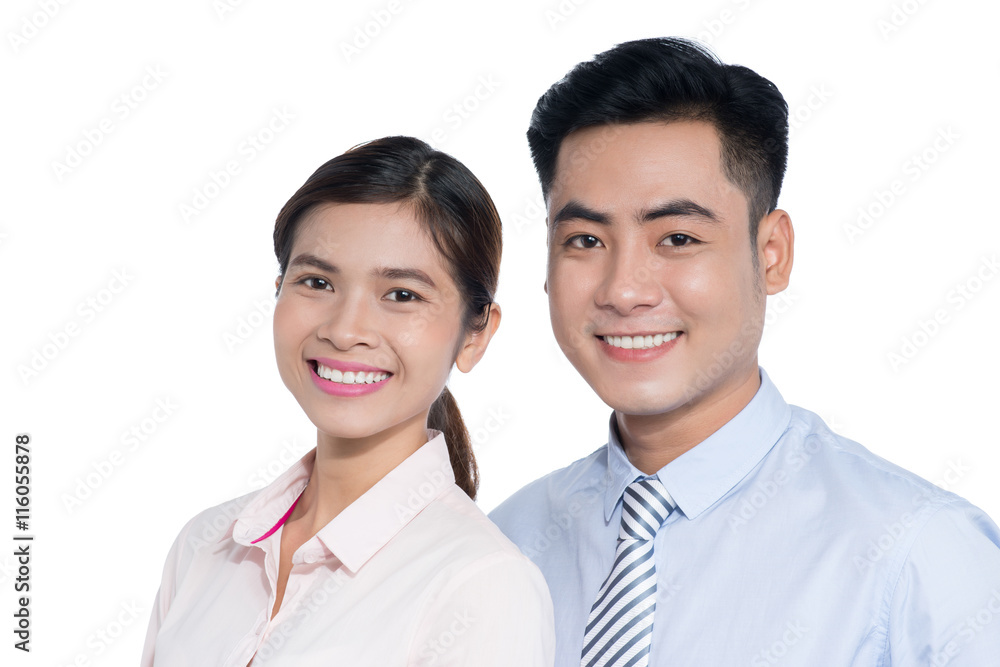 A smiling business man and woman are posing A smiling business man and woman are posing