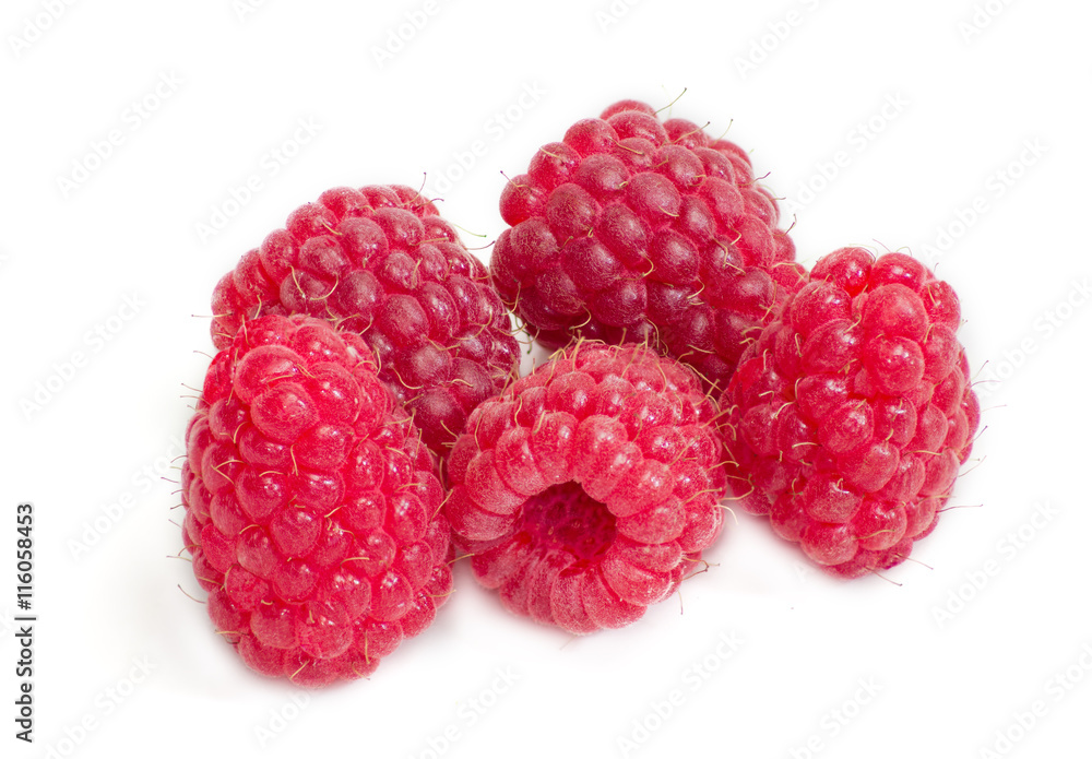 Several berries of red raspberry on a light background closeup Several berries of red raspberry on a light background closeup
