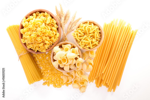assorted raw pasta on white background
