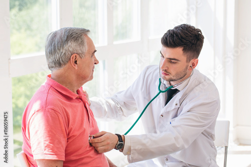 Senior man being examined by a doctor