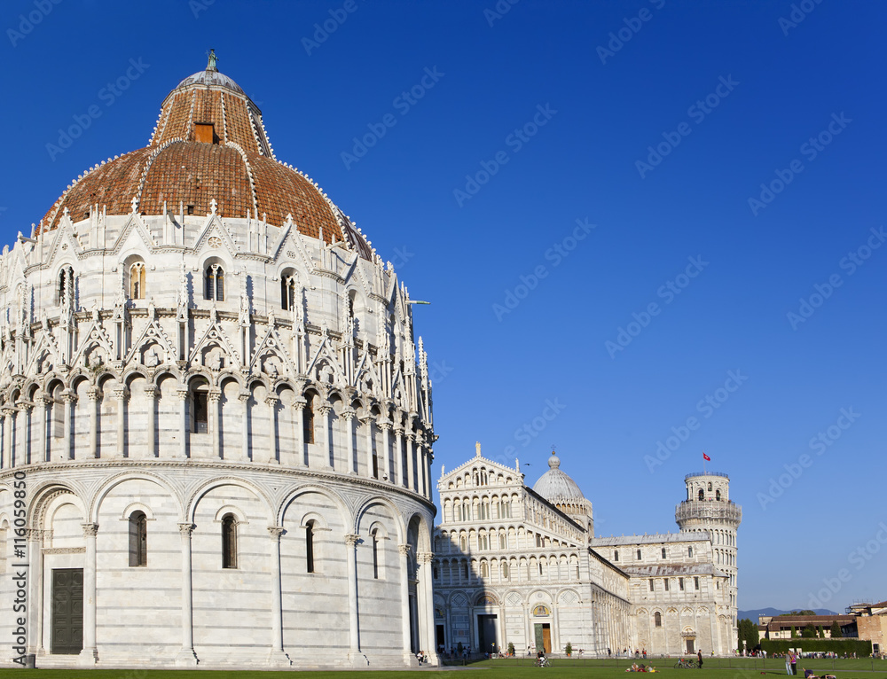 The Baptistry and the Leaning Tower in Cathedral Square in Pisa, Italy..