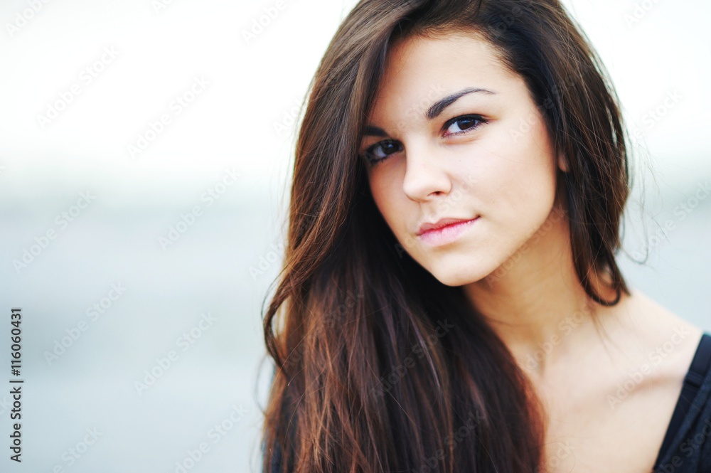 portrait of a beautiful girl with long hair in a black shirt