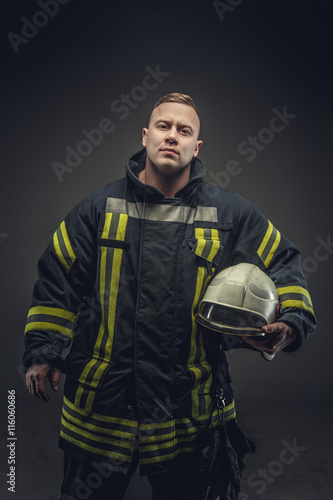 Portrait of male in firefighter costume.