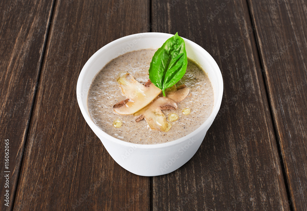 Hot food delivery - mushroom soup at wood Hot food delivery - mushroom soup at wood