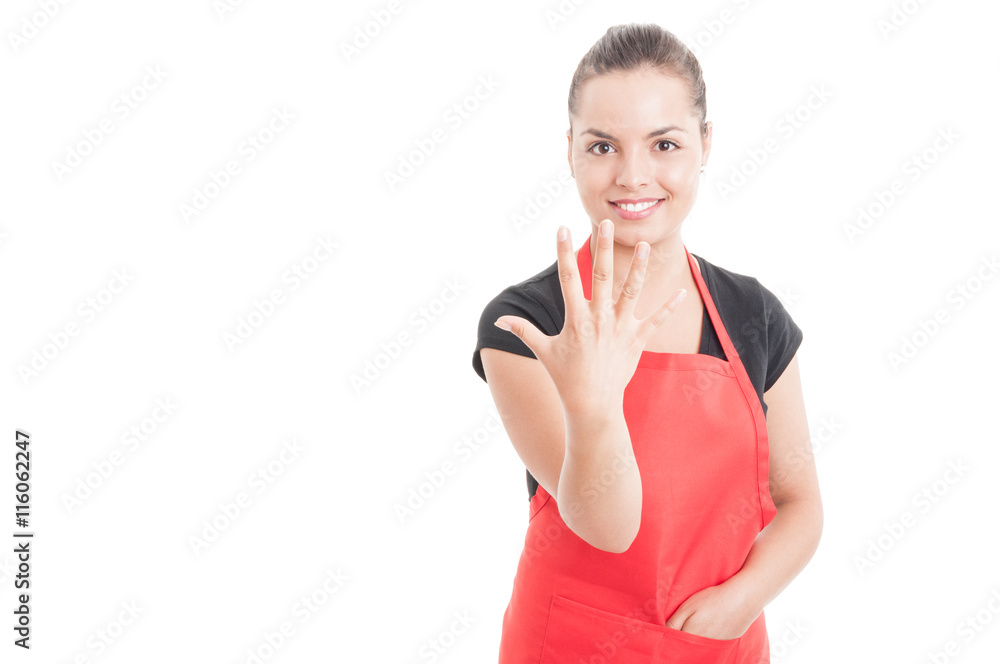 Cheerful hypermarket employee rising five fingers Cheerful hypermarket employee rising five fingers