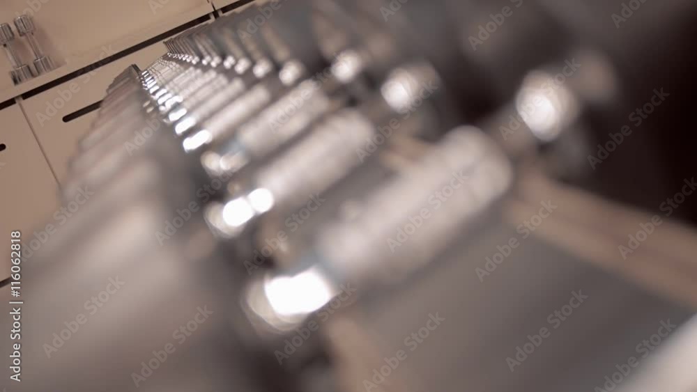 Rows of dumbbells in modern sports club Rows of dumbbells in modern sports club