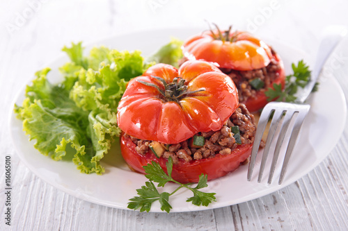 stuffed tomato with beef and salad