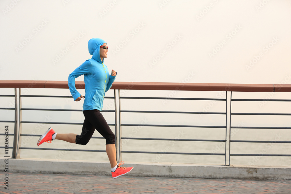 young fitness woman runner running at seaside young fitness woman runner running at seaside