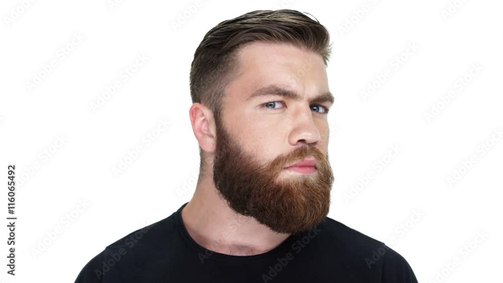 Serious young pensive man looking at camera Serious young pensive man looking at camera