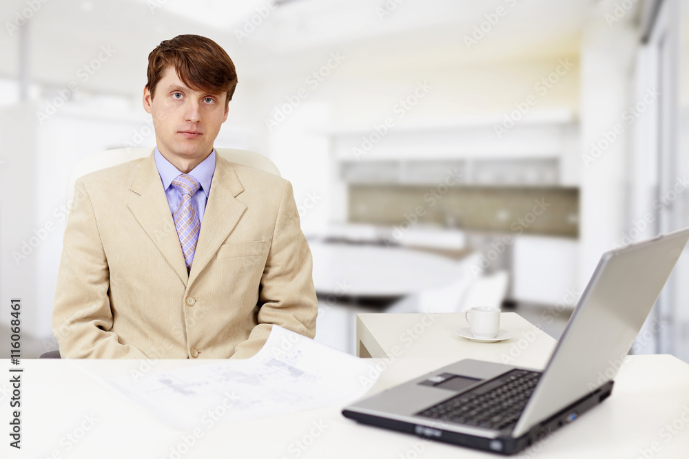 Young serious businessman on a workplace