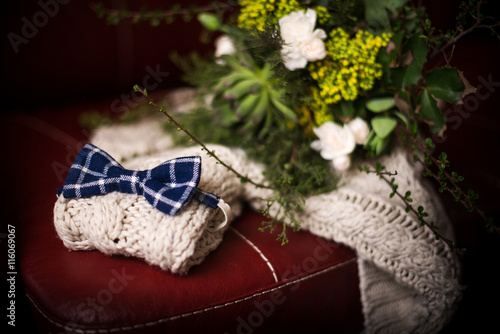 Blue bow tie and rustic bouquet was made of succulents