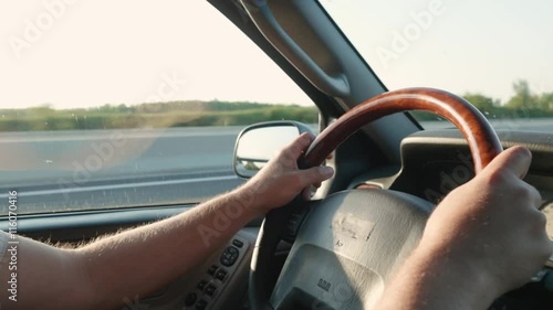 Wallpaper Mural Driving in the sun, close-up of hands on the steering wheel. 
 Torontodigital.ca
