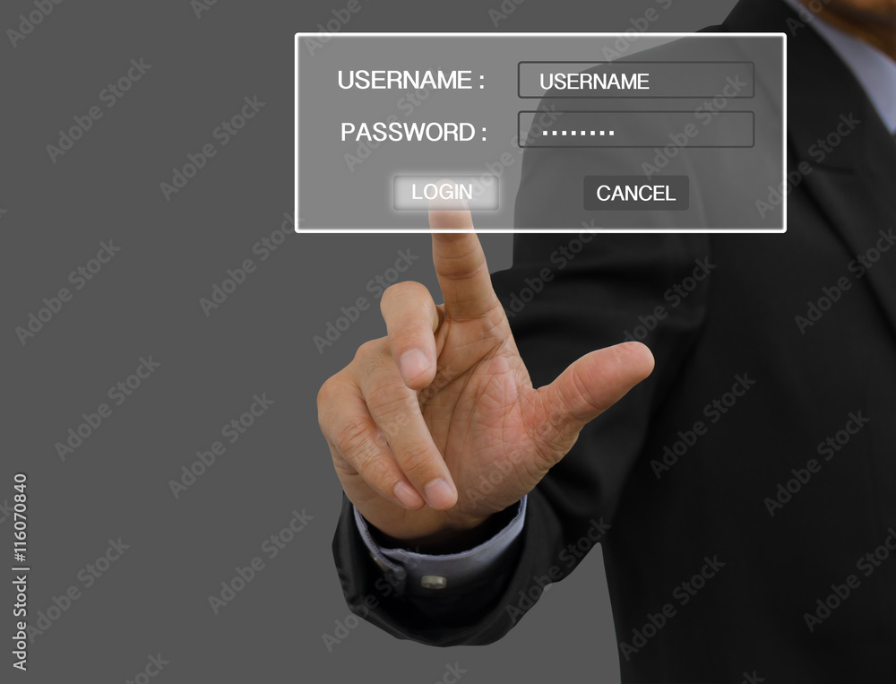 Businessman in black suit signing in computer on virtual screen Businessman in black suit signing in computer on virtual screen