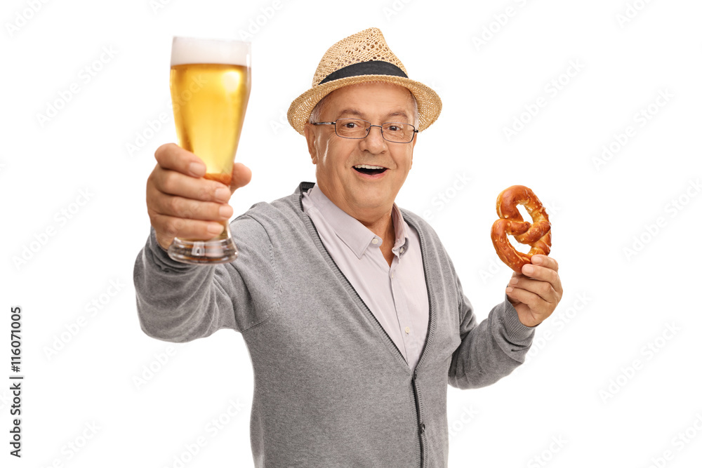 Mature man holding beer and pretzel
