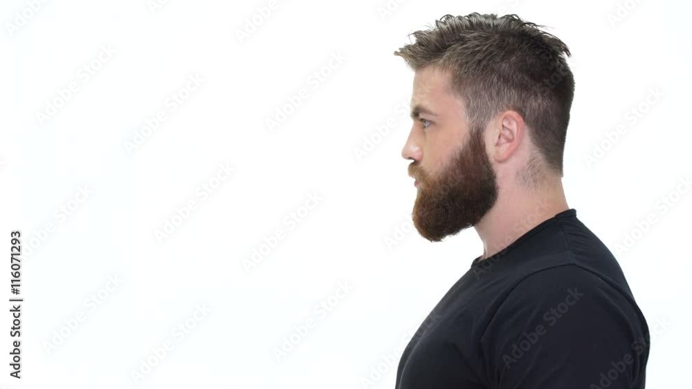 Side view of a handsome bearded brutal man looking away Side view of a handsome bearded brutal man looking away