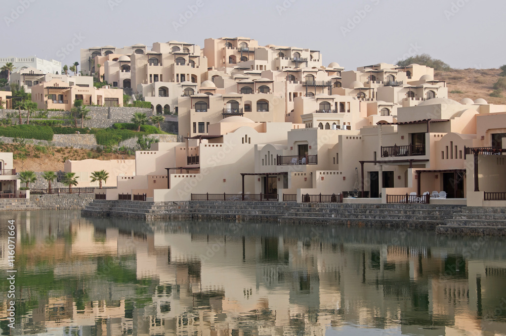 Arabian homes overlooking a pond in the UAE