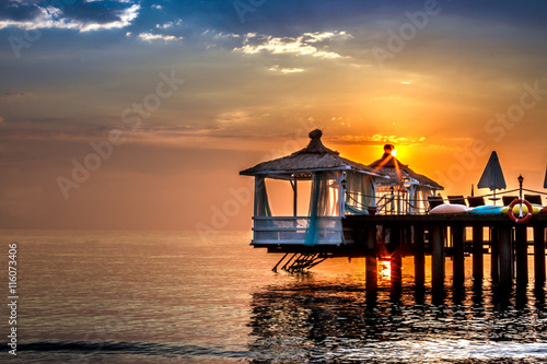  beautiful sunrise over water bungalows