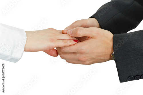Women's hand in men's hands on white