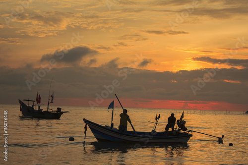 one couple will sail for fishing at dawn ; southern of Thailand 