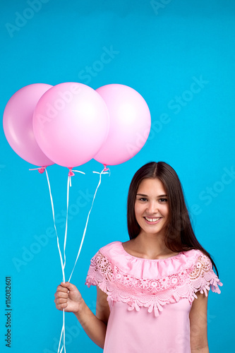 beautiful young girl with pink balloons