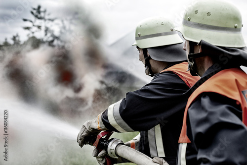 Fire brigade extinguishing fire