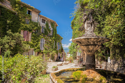 Village of Saignon with old square with fountain in the Luberon park, Provence, France photo