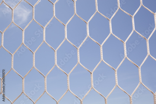 White football  soccer net and blue sky